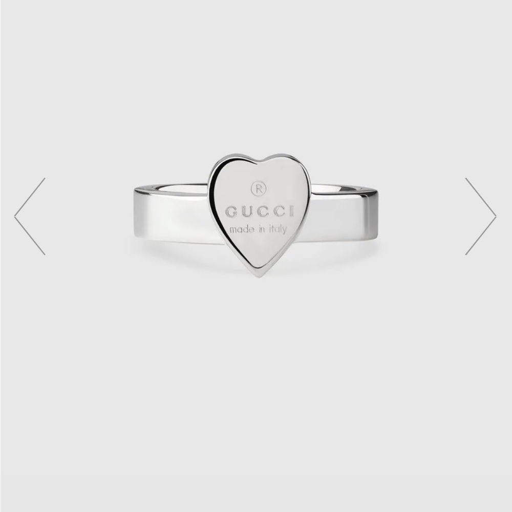 GUCCI Trademark ring with heart pendant.